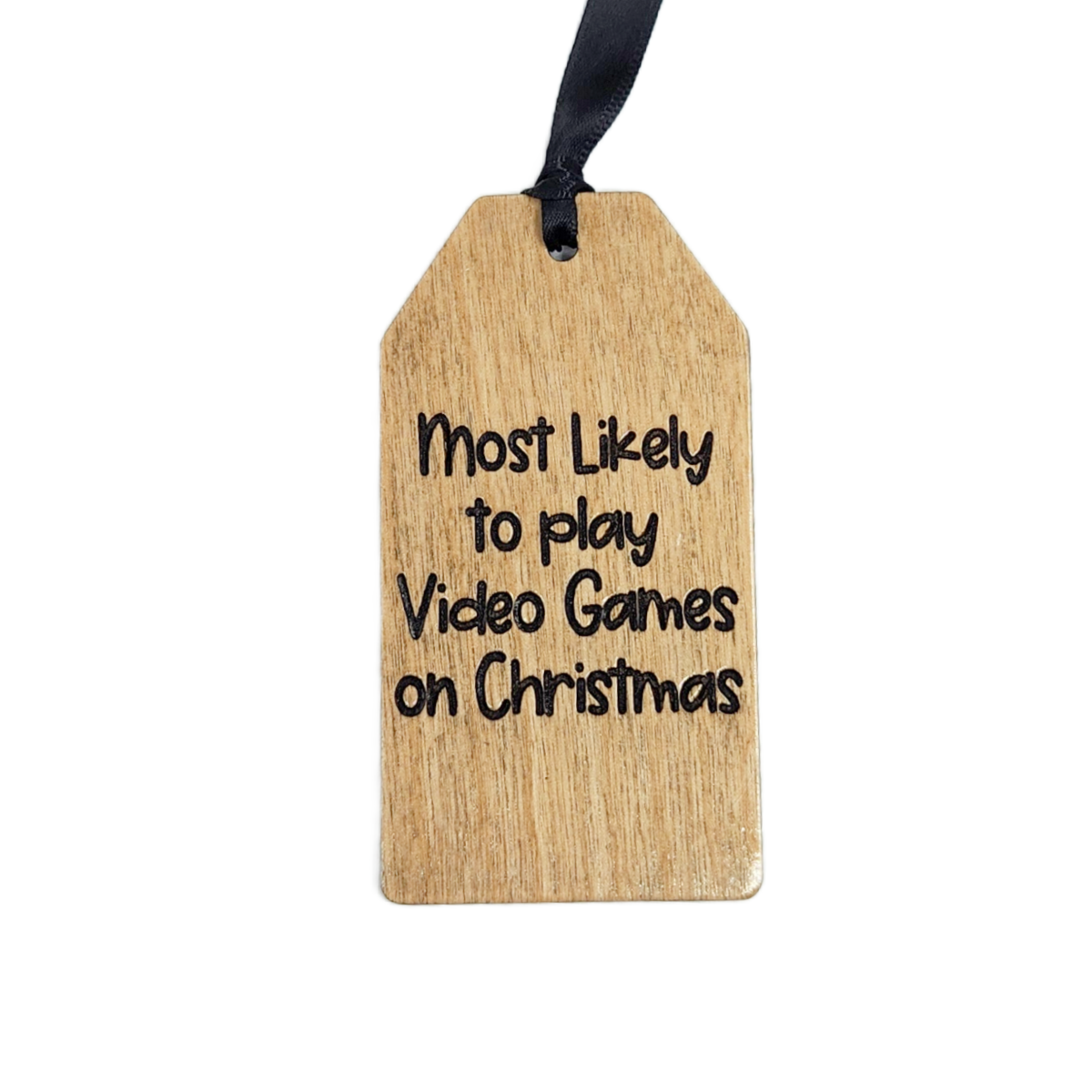 Wooden tag with text 'Most Likely to play Video Games on Christmas' on a white background